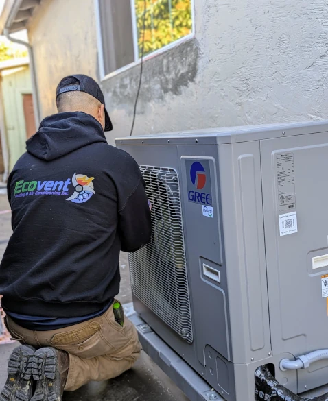 ac technician working on a unit